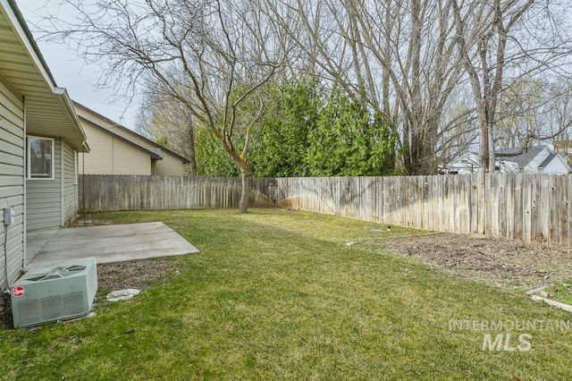 view of yard with a patio, central air condition unit, and a fenced backyard