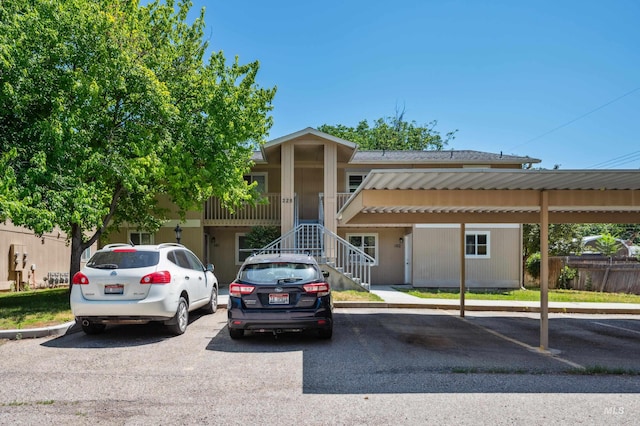 228 N Latah St, Boise, ID 83706 - view of property featuring covered and uncovered parking and stairs