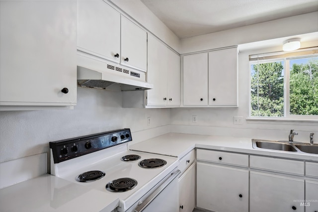 228 N Latah St, Boise, ID 83706 - kitchen with white electric range, under cabinet range hood, white cabinetry, and light countertops