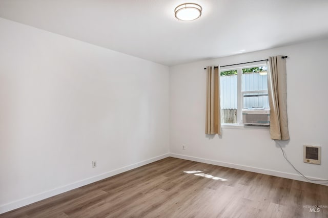 228 N Latah St, Boise, ID 83706 - spare room featuring wood finished floors and heating unit