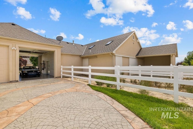 4119 N Park Ln, Eagle, ID 83616 - view of side of home featuring stucco siding, a garage, and driveway