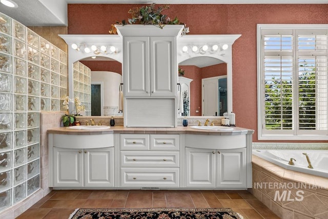 4119 N Park Ln, Eagle, ID 83616 - bathroom featuring double vanity, a garden tub, and tile patterned floors