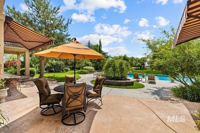 4119 N Park Ln, Eagle, ID 83616 - view of patio / terrace with outdoor dining space and an outdoor pool