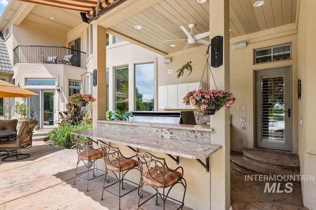 4119 N Park Ln, Eagle, ID 83616 - patio / terrace with a ceiling fan, a patio, and exterior kitchen