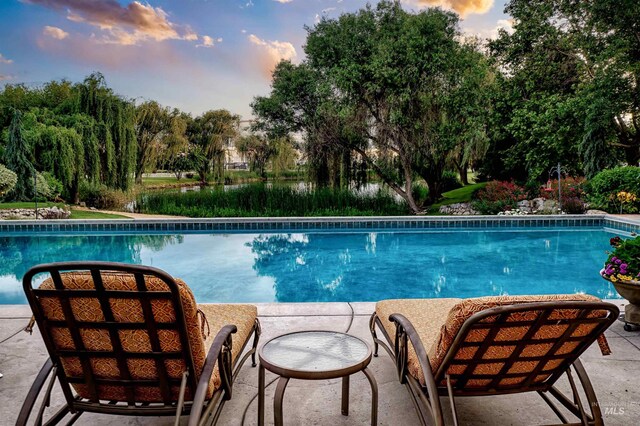 4119 N Park Ln, Eagle, ID 83616 - outdoor pool featuring a patio area and view of scattered trees