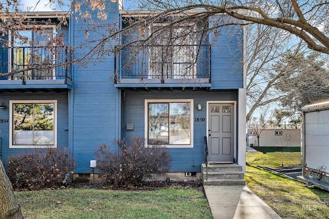 1850 E Old Saybrook Ln, Boise, ID 83706 - view of front facade with a balcony and a front yard