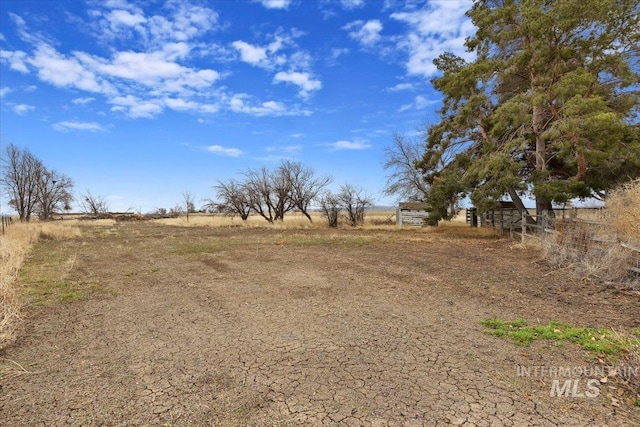 view of yard with a rural view