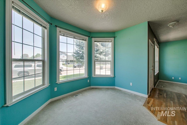 1239 Willow Creek Dr, Nampa, ID 83686 - carpeted spare room featuring a textured ceiling and baseboards