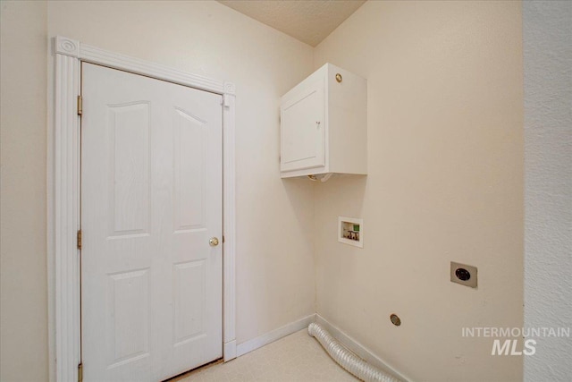 1239 Willow Creek Dr, Nampa, ID 83686 - laundry room featuring electric dryer hookup, cabinet space, hookup for a washing machine, and baseboards