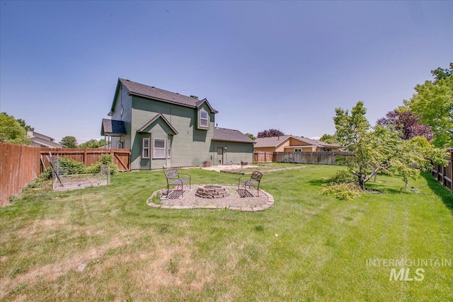 1239 Willow Creek Dr, Nampa, ID 83686 - back of house featuring a fire pit and a patio