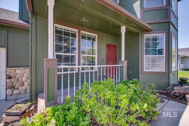 1239 Willow Creek Dr, Nampa, ID 83686 - view of exterior entry featuring a porch