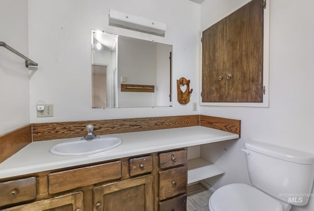 bathroom with vanity, toilet, and a wall unit AC