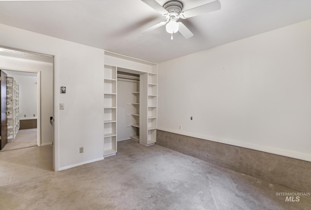 unfurnished bedroom featuring light colored carpet, ceiling fan, and a closet