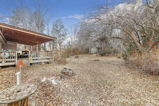 view of yard featuring a wooden deck