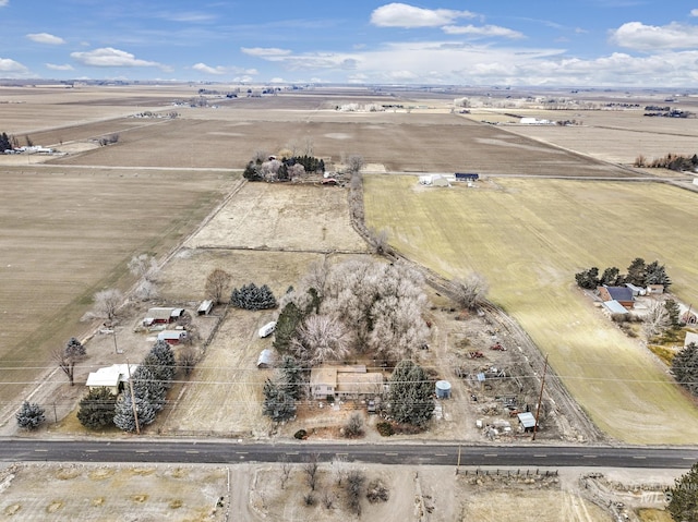 birds eye view of property with a rural view