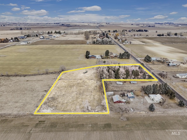 birds eye view of property with a rural view