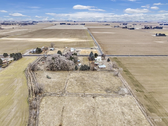 birds eye view of property with a rural view