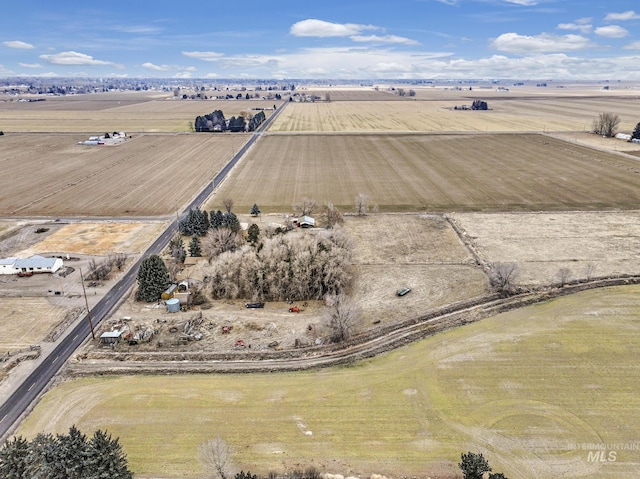 birds eye view of property featuring a rural view