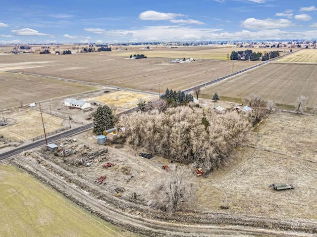 birds eye view of property with a rural view