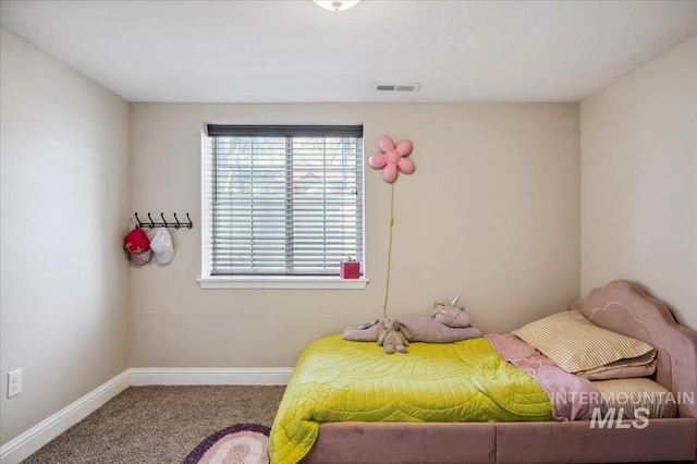 carpeted bedroom with baseboards and visible vents