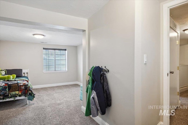 interior space with baseboards and visible vents
