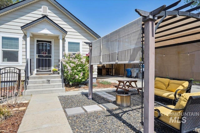doorway to property featuring a patio and fence