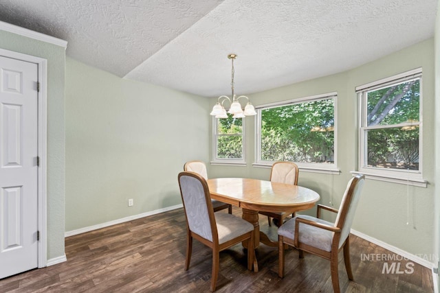 1548 N Vineyards Ave, Meridian, ID 83642 - dining area featuring a textured ceiling, dark wood-type flooring, a chandelier, and baseboards