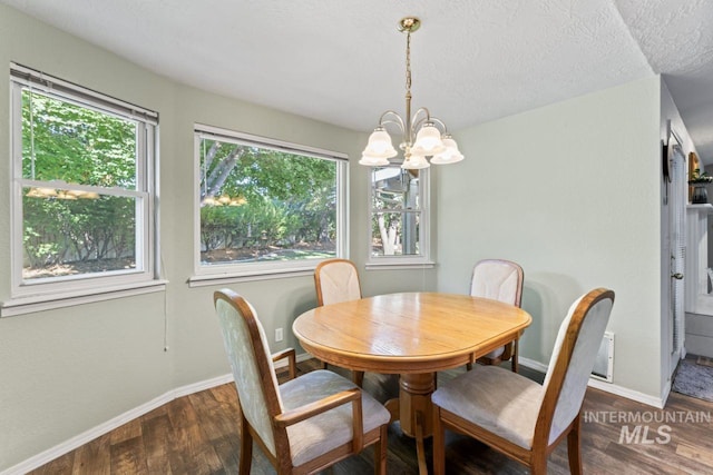 1548 N Vineyards Ave, Meridian, ID 83642 - dining space with wood finished floors, a chandelier, and baseboards
