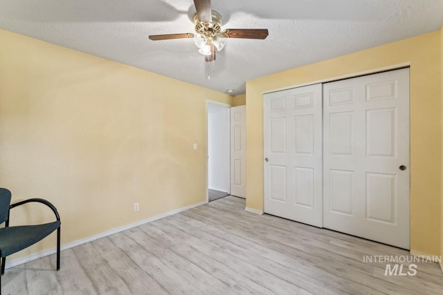 1548 N Vineyards Ave, Meridian, ID 83642 - unfurnished room with wood finished floors, a ceiling fan, baseboards, and a textured ceiling