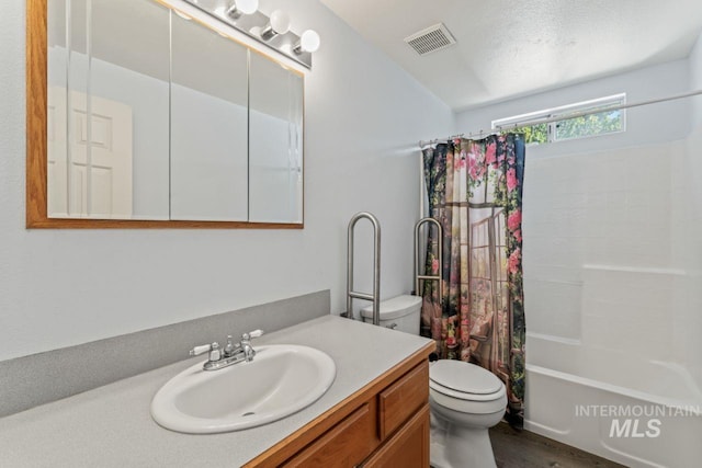 1548 N Vineyards Ave, Meridian, ID 83642 - bathroom featuring toilet, vanity, and shower / bath combo with shower curtain