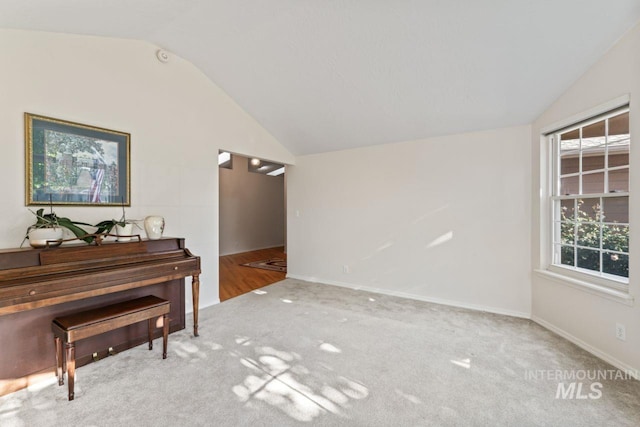 1548 N Vineyards Ave, Meridian, ID 83642 - living area featuring lofted ceiling, carpet flooring, and baseboards