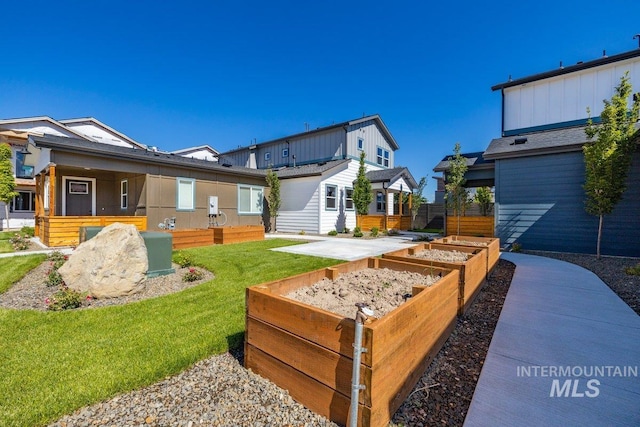 1438 N Cole Cottage Ln, Boise, ID 83704 - view of green lawn featuring a garden