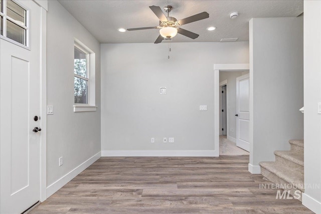 1438 N Cole Cottage Ln, Boise, ID 83704 - unfurnished room featuring ceiling fan, stairs, baseboards, a smoke detector, and recessed lighting