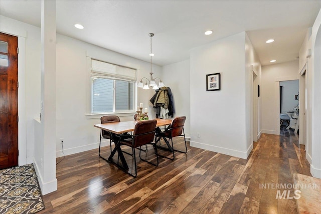 dining room featuring baseboards, dark wood finished floors, a notable chandelier, and recessed lighting