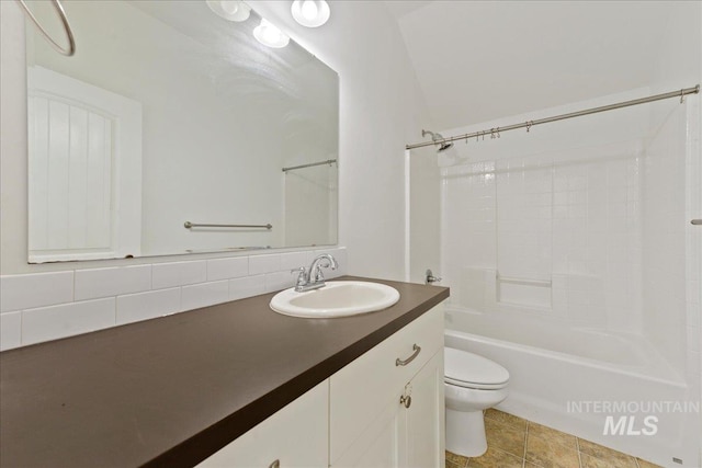 full bathroom featuring tub / shower combination, vanity, toilet, and tile patterned floors