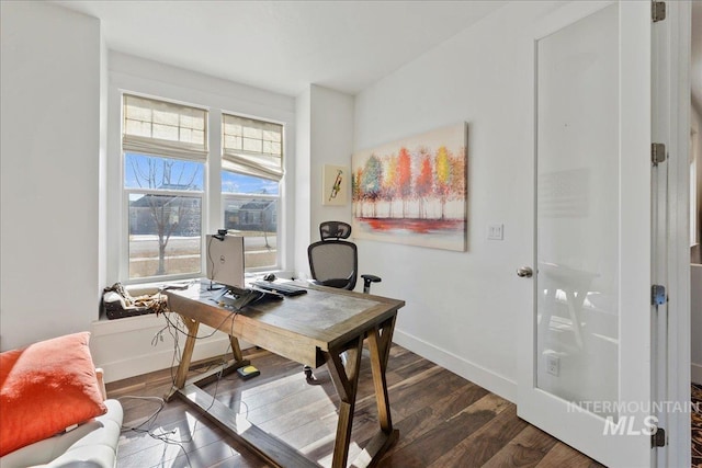 office space featuring baseboards and dark wood finished floors