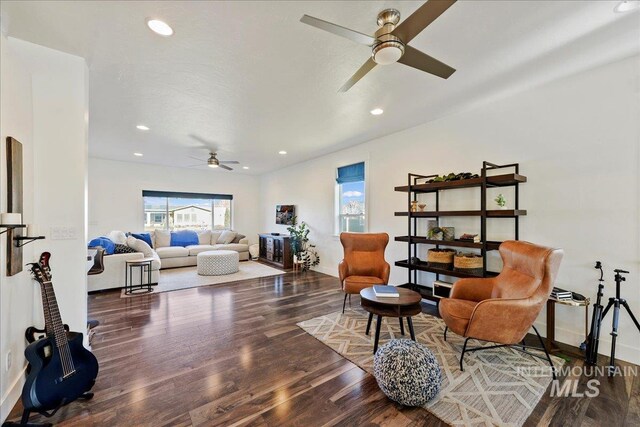 living area with recessed lighting, baseboards, and wood finished floors