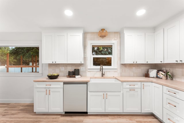 1600 E Victory Rd, Boise, ID 83706 - kitchen featuring dishwasher, a sink, backsplash, light countertops, and recessed lighting