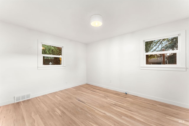 1600 E Victory Rd, Boise, ID 83706 - spare room featuring healthy amount of natural light, light wood finished floors, and baseboards