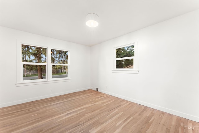 1600 E Victory Rd, Boise, ID 83706 - empty room with baseboards and light wood-style flooring