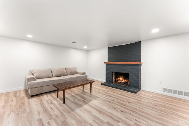 1600 E Victory Rd, Boise, ID 83706 - living room featuring a fireplace, light wood-type flooring, recessed lighting, and baseboards