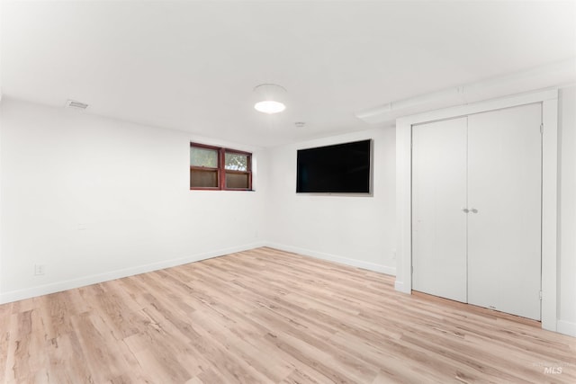 1600 E Victory Rd, Boise, ID 83706 - unfurnished bedroom with light wood-type flooring, baseboards, and a closet
