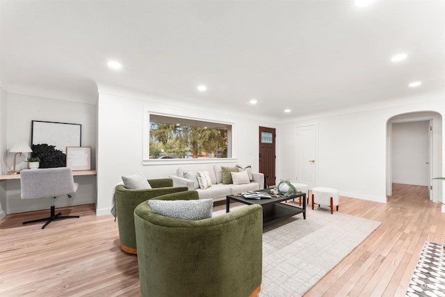 1600 E Victory Rd, Boise, ID 83706 - living room featuring arched walkways, light wood-style floors, recessed lighting, and baseboards