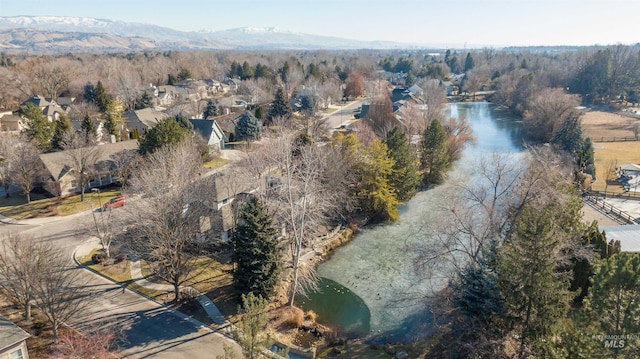 aerial view featuring a water and mountain view