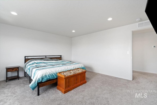 bedroom featuring baseboards, recessed lighting, and carpet