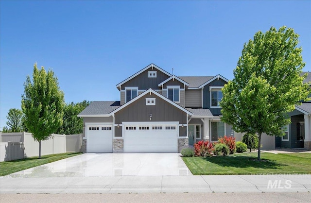1123 Drexel Hill Ave, Caldwell, ID 83605 - craftsman house featuring board and batten siding, a garage, driveway, and stone siding