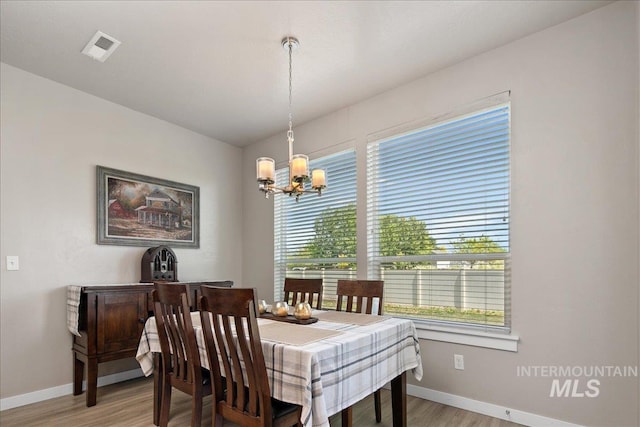 1123 Drexel Hill Ave, Caldwell, ID 83605 - dining area featuring a chandelier, plenty of natural light, and baseboards