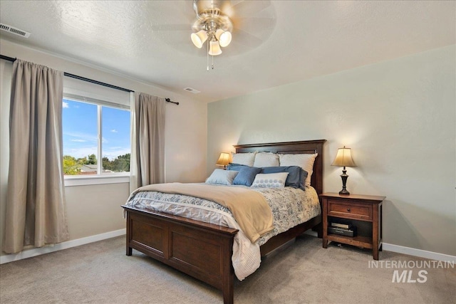 1123 Drexel Hill Ave, Caldwell, ID 83605 - bedroom featuring baseboards, light carpet, and a ceiling fan