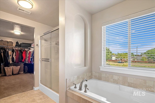 1123 Drexel Hill Ave, Caldwell, ID 83605 - full bath featuring a stall shower, a garden tub, and a spacious closet