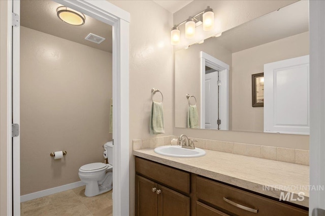 1123 Drexel Hill Ave, Caldwell, ID 83605 - bathroom with toilet, vanity, tile patterned flooring, and baseboards